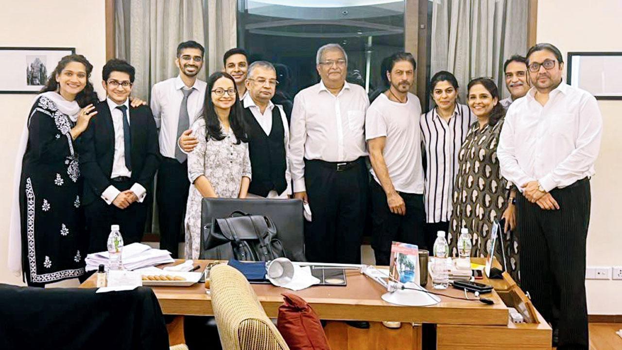 In the first photograph that emerged after Aryan Khan's bail on October 28, Shah Rukh Khan was seen posing and smiling with his legal team headed by Satish Maneshinde. Pic/mid-day correspondent