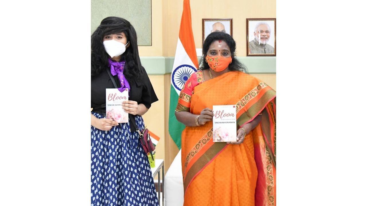 Author Sneha Narayanan presents her poetry book Bloom to Dr. Tamilisai Soundararajan