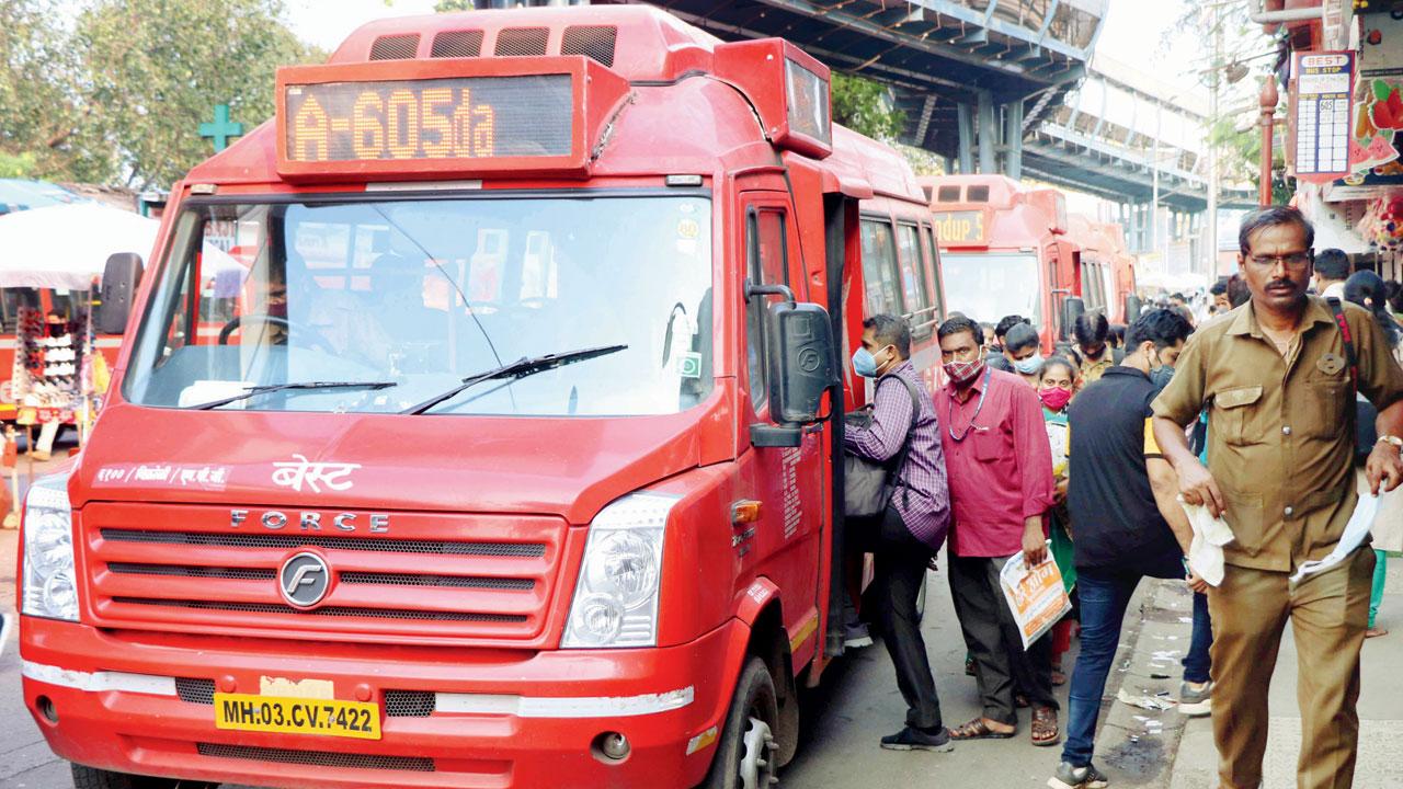 Commuters board an AC minibus at Bhandup on Thursday. Pic/Rajesh Gupta