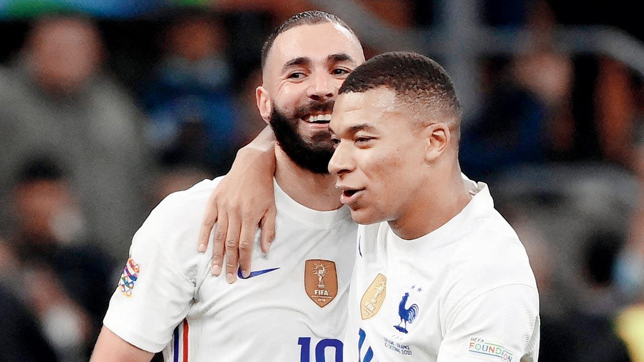 Karim Benzema (left) and Kylian Mbappe after a goal. Pic/AFP