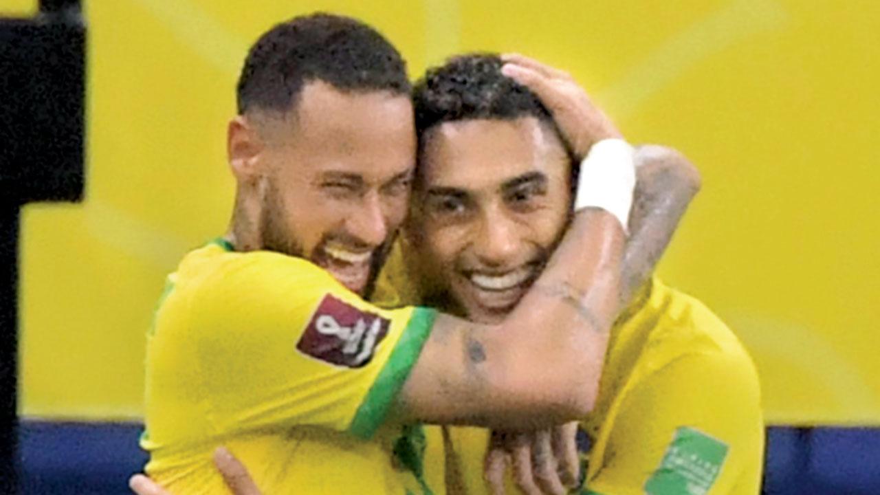 Brazil’s Raphinha (right) celebrates with Neymar after scoring against Uruguay in Arena Amazonia, Brazil, on Thursday