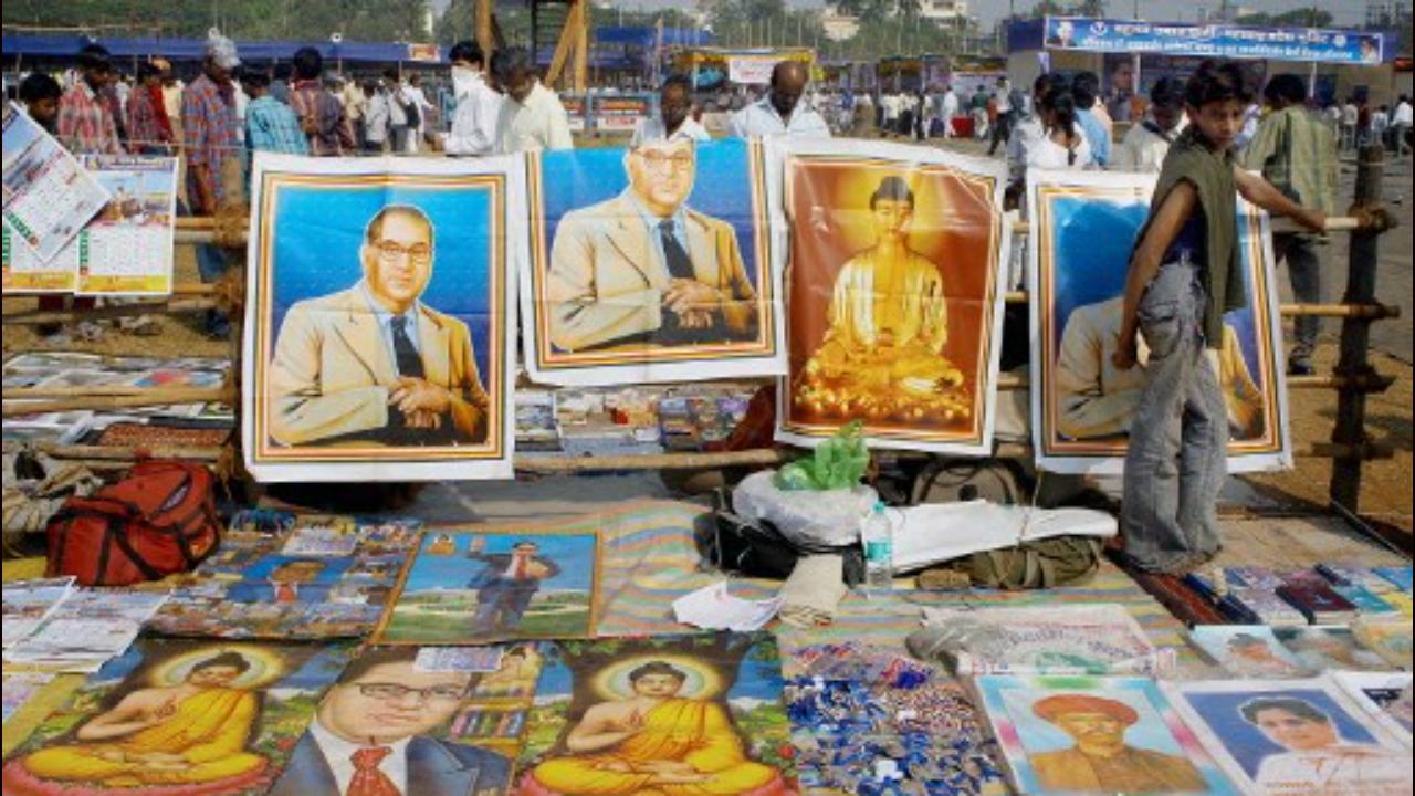 Dr Ambedkar had decided to renounce Hinduism two decades before he converted to Buddhism. Taking into account the oppression and injustice meted out to the people belonging to the depressed classes of the same Hindu community at the Yeola conference of October 13, 1935, Dr Ambedkar pledged that though he was “unfortunately” born as a Hindu, “he will not die as a Hindu”. In this picture, a vendor sells pictures of Buddha and Dr Ambedkar on his 50th death anniversary in Mumbai on December 6, 2006. Photo: AFP.