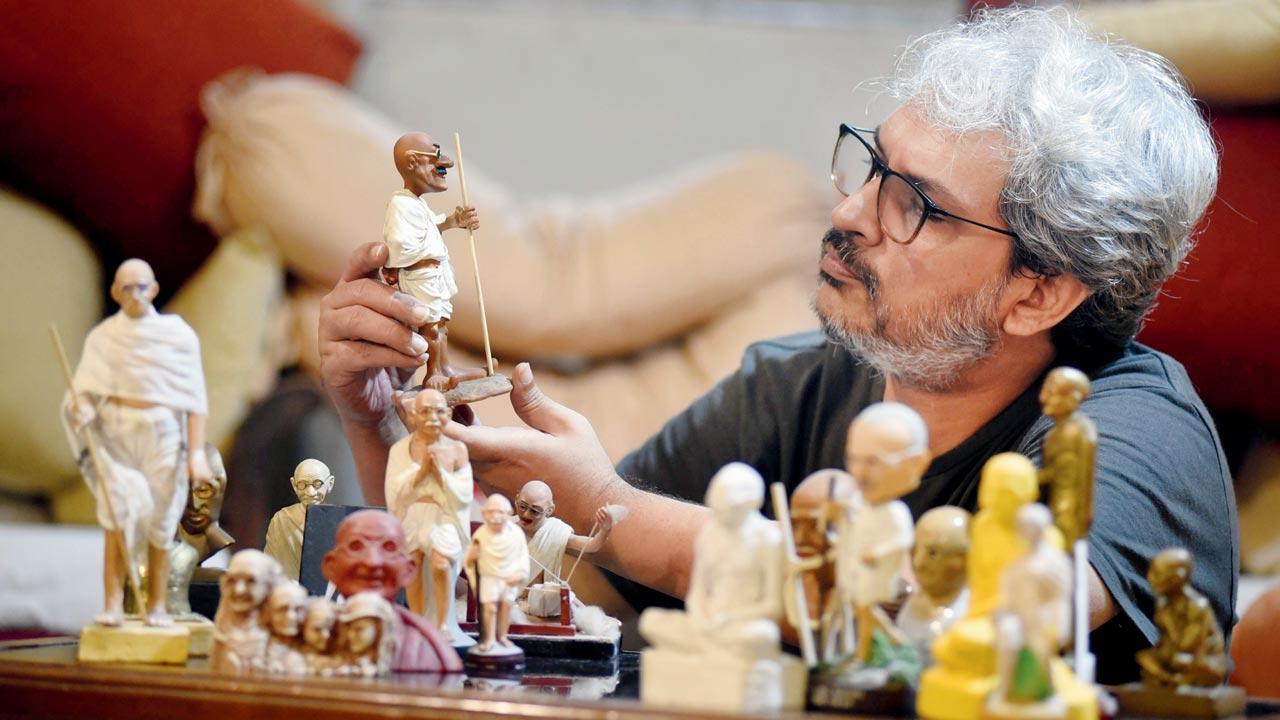 Chirodeep Chaudhuri has figurines of Gandhi made using clay, wood, brass, plastic, paper, aluminium, mother of pearl, plaster of Paris, ceramic, sandalwood, resin, wire, glass and chalk. Pic/Sameer Markande