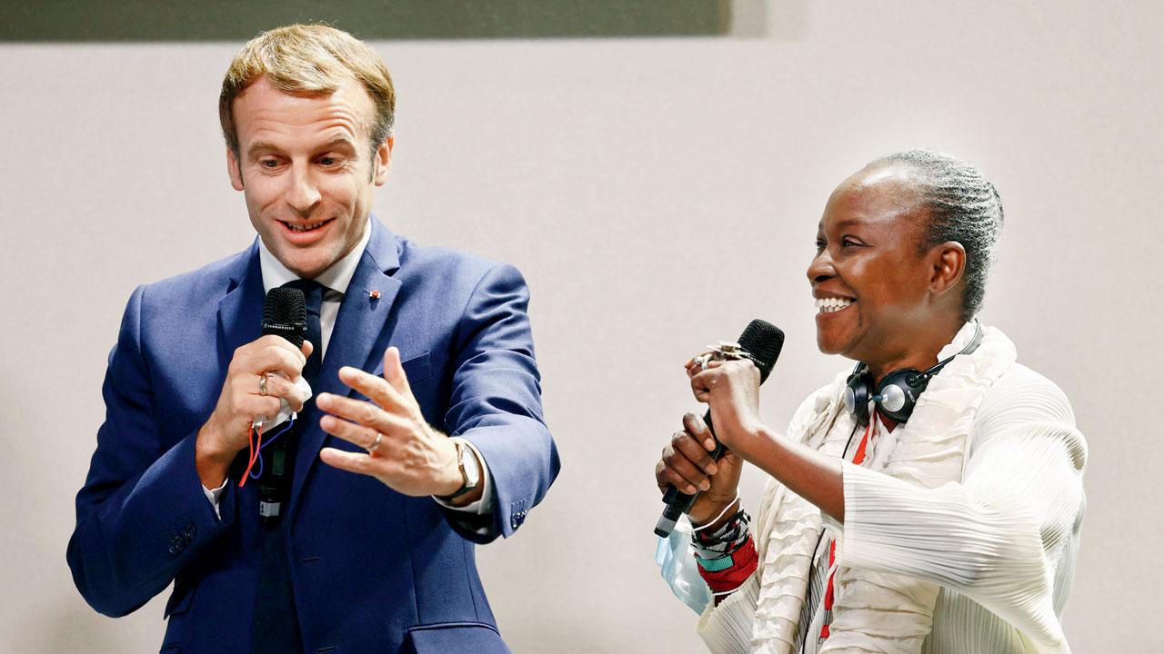 Cameroonian curator Koyo Kouoh with French President Emmanuel Macron. Pics/AFP