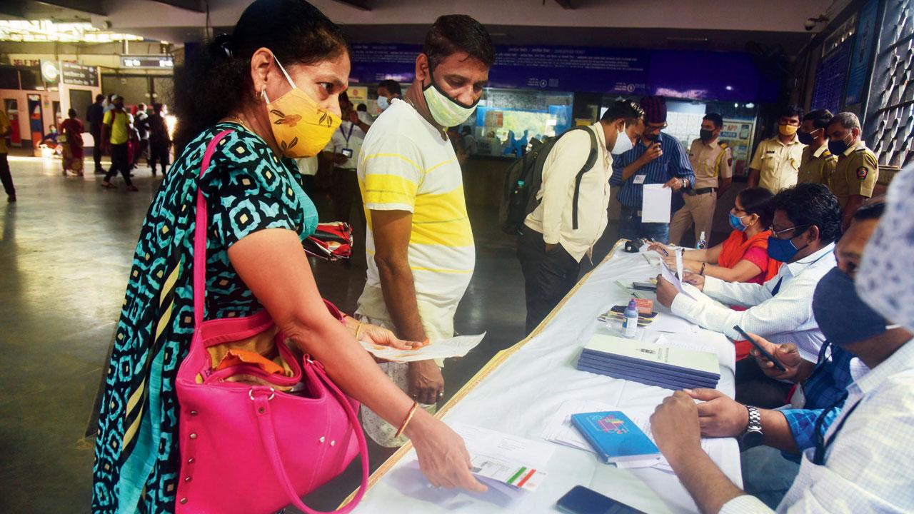 Central Railway staff and BMC workers check documents of commuters at Sion railway station in August this year. File pic