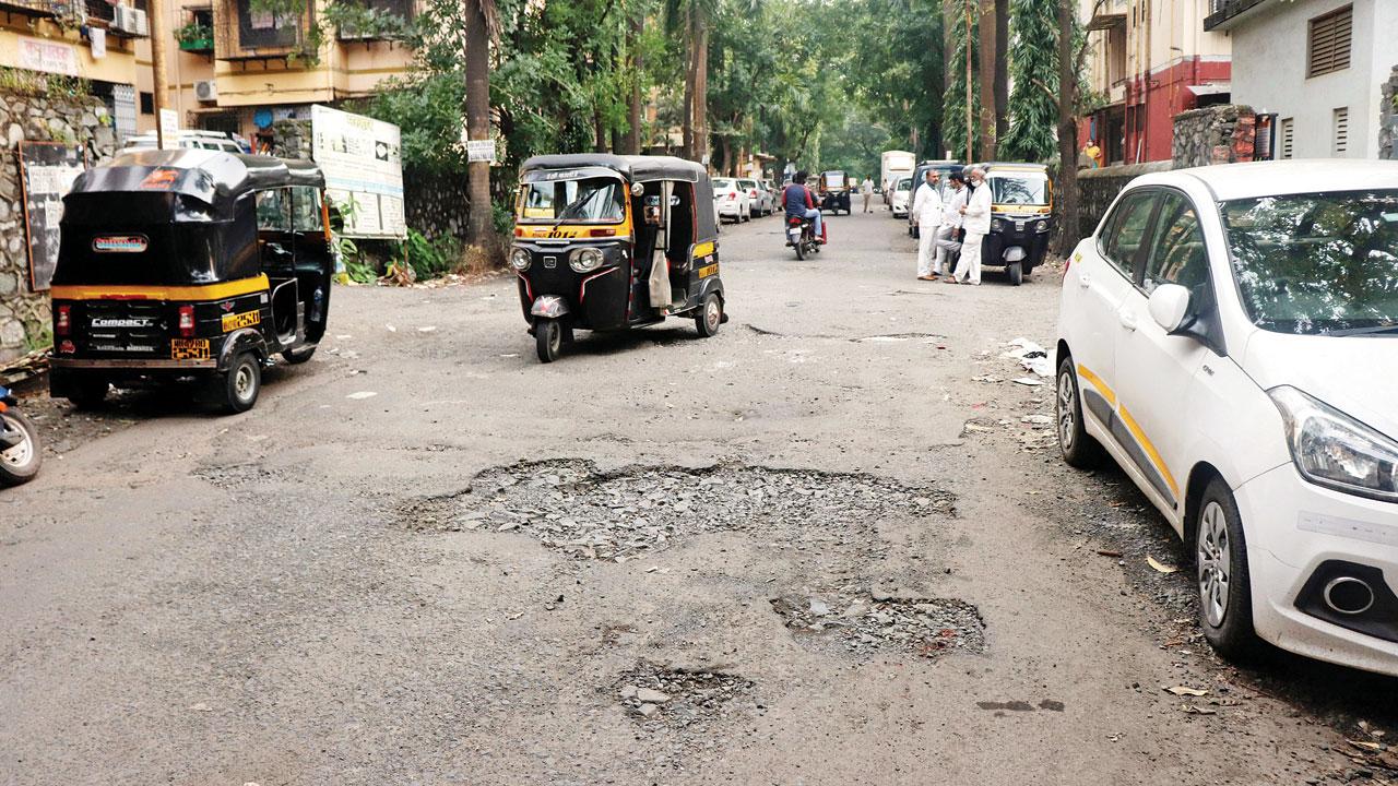 Potholes at Goregaon East on Thursday. Pic/Anurag Ahire