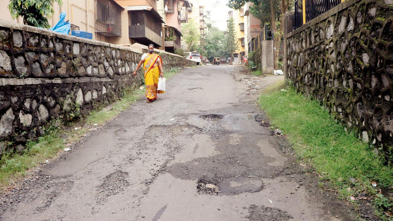 Potholes at Goregaon East on Thursday. Pic/Anurag Ahire