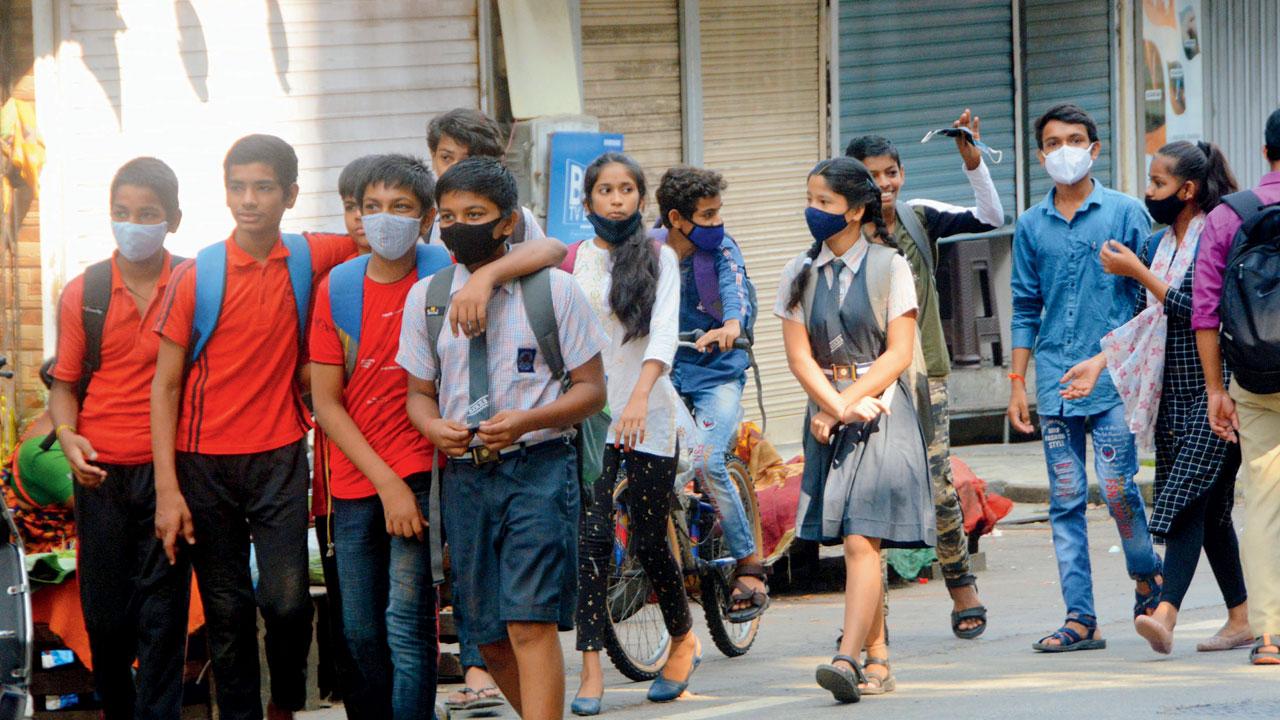 Students of Shri Vibhuti Narayan High School return home on the first day of reopening. Teachers say their work extends beyond classes. Pic/Satej Shinde