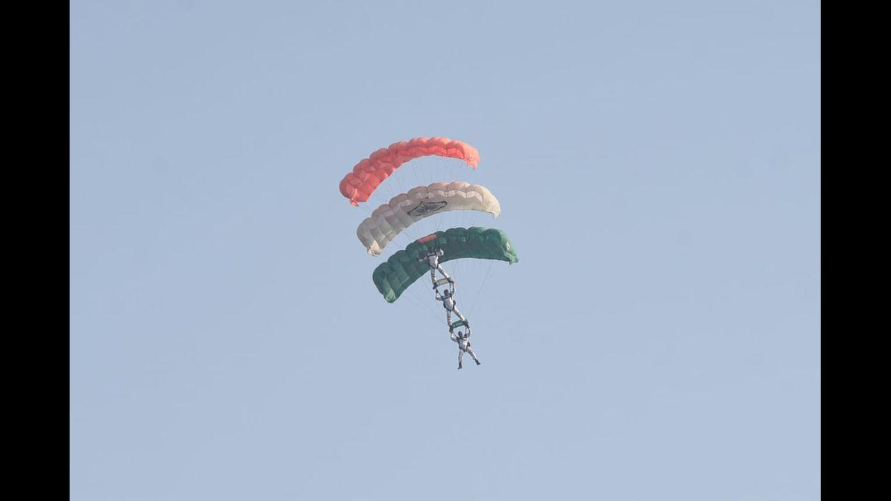 Indian Air Force (IAF) paratroopers from the 'Akashganga' skydiving team glide during the 89th Air Force Day parade at Hindon Air Force station in Ghaziabad. Pic/Pallav Paliwal