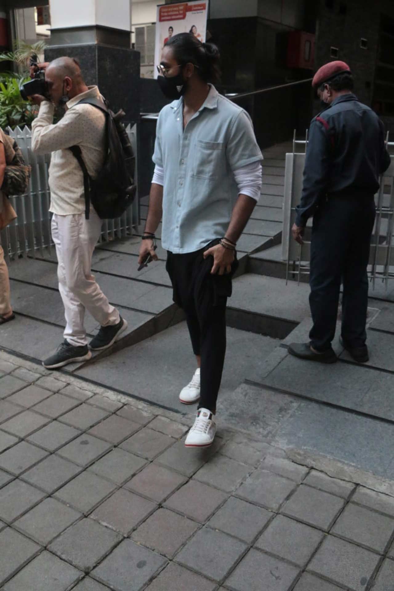 The actress sported a black crop top, which she paired with black joggers during the outing. She completed her look with a black bag and white sneakers.