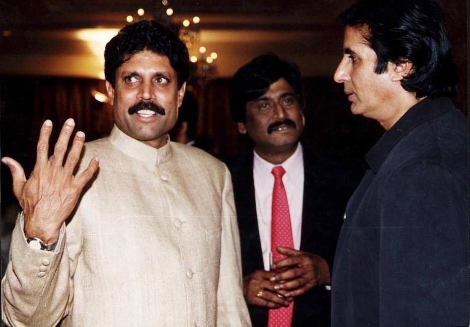 Kapil Dev and Amitabh Bachchan at an event.