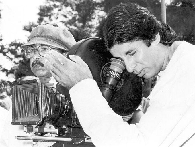 In this candid picture, Amitabh Bachchan plays director in between shots of his film.