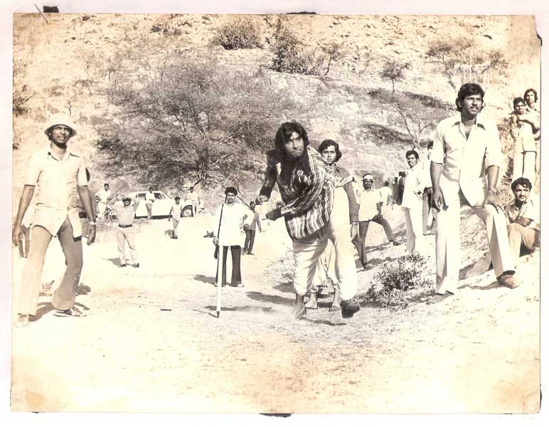 Amitabh Bachchan during a game of cricket on the sets of one of his films.
