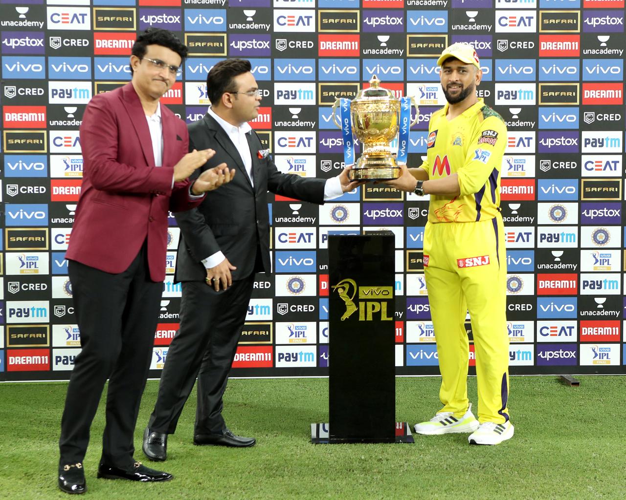 MS Dhoni captain of CSK receives the trophy from BCCI president Sourav Ganguly and Secretary of the BCCI Jay Shah after winning the IPL 2021 final. This victory was poetic as it was also MS Dhoni's 300th match as captain of a T20 team. Dhoni has 4 IPL titles to his name