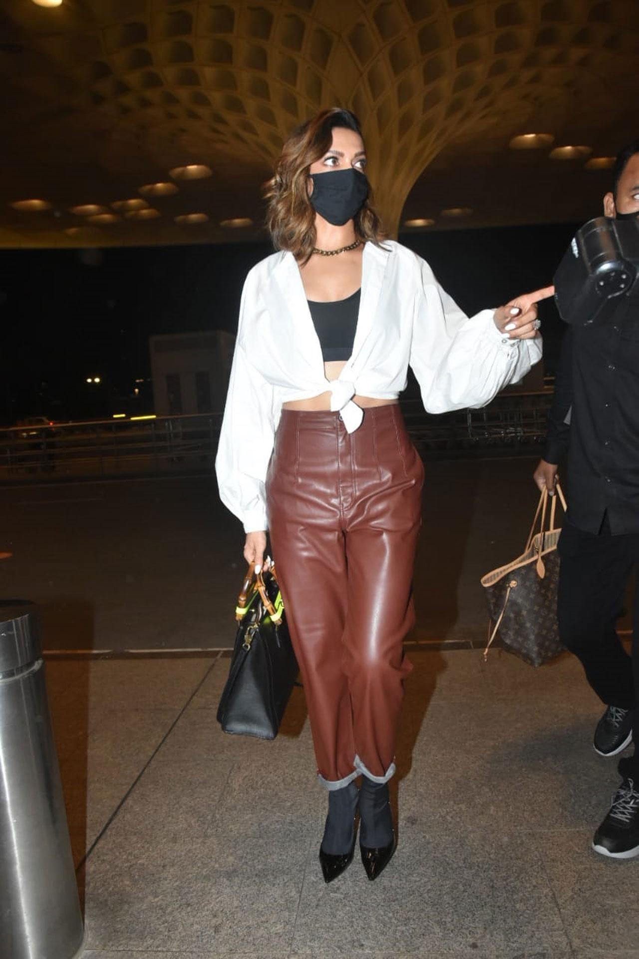 Deepika makes a stunning airport appearance in leather pants and crop shirt image picture