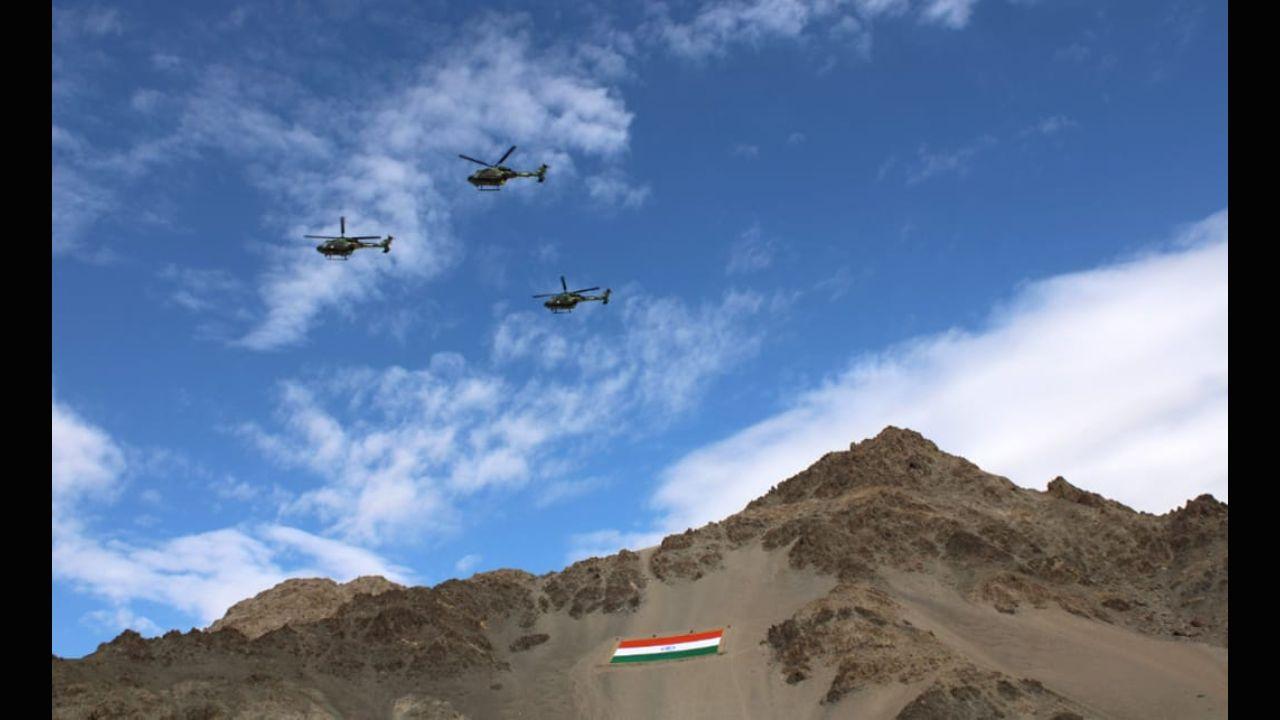 Advanced Light Helicopters of the Army Aviation Squadron carried out a fly past and showered flower petals over the national flag.