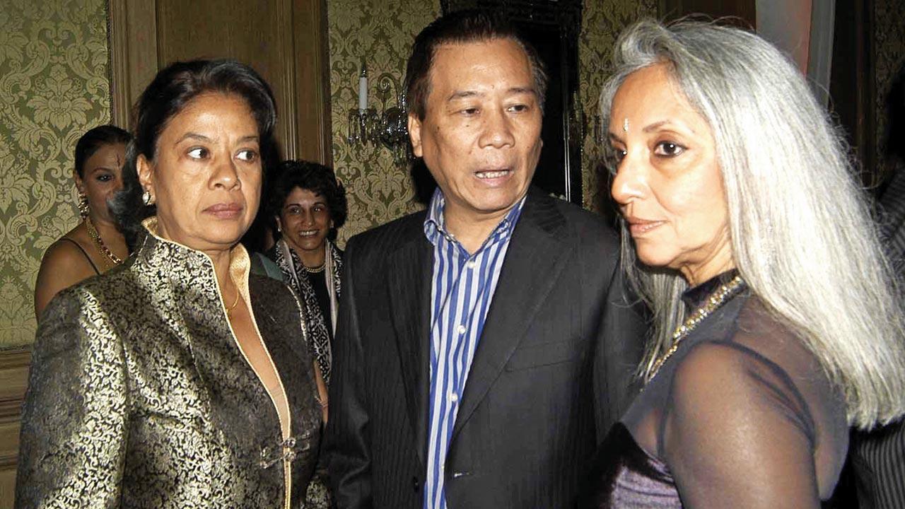 Henry Tham (centre) with his wife (left) and Monica Vazirali at a party