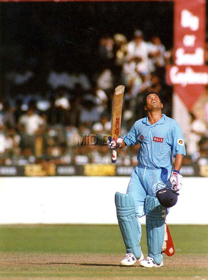 Sachin Tendulkar looks up to the skies after completing a century against Pakistan