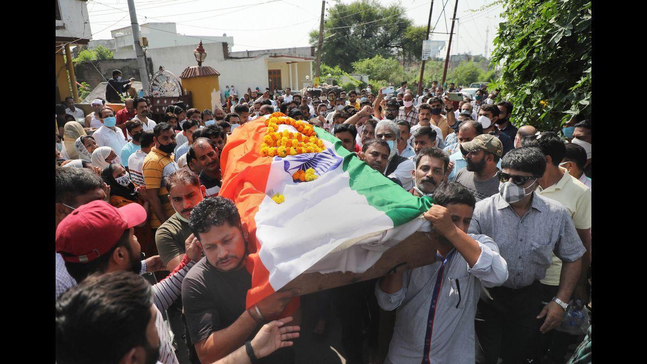 Family members, relatives and locals carry the mortal remains of Deepak Chand, a teacher who was killed by militants during a terrorist attack in Srinagar. Pic/PTI