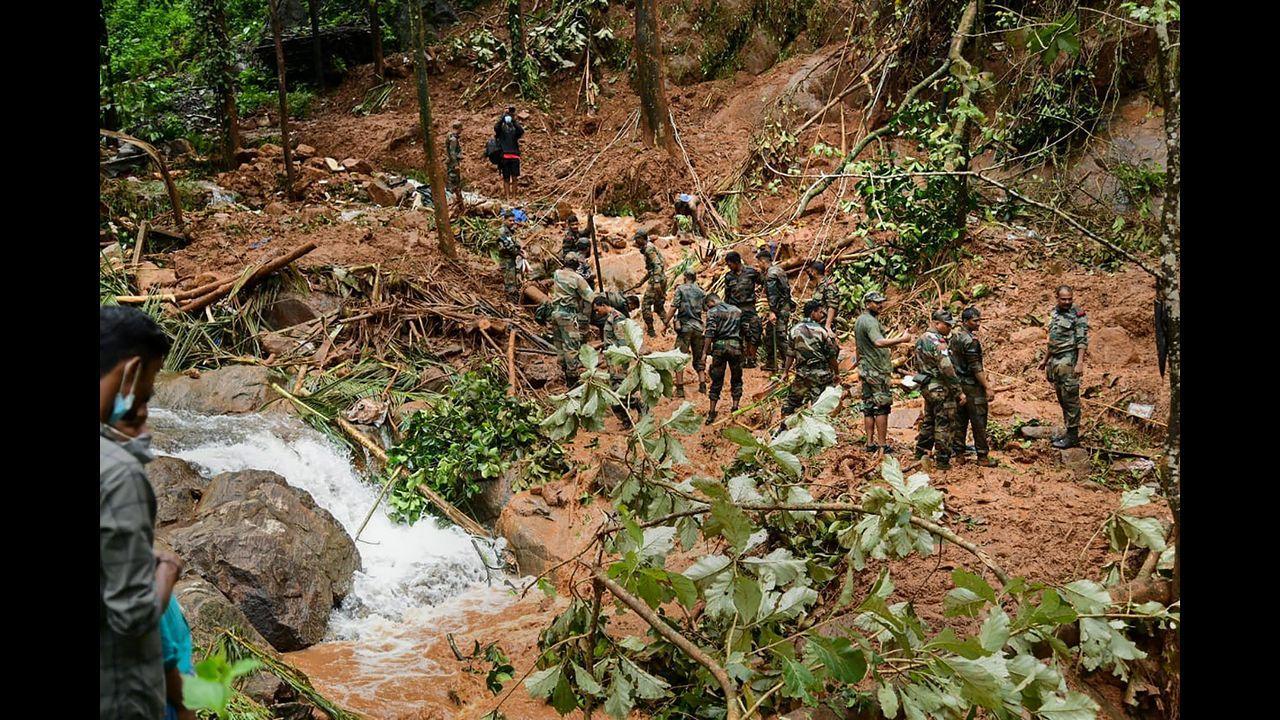  Rapid Action Force (RAF) and Kerala Fire and Rescue personnel during rescue operations at the site of landslide at Kavali in Kottayam district. Pic/PTI