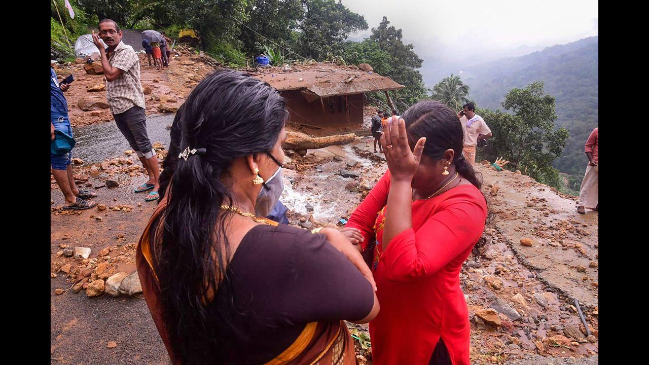 A woman breaks down as her house damaged in landslide due to heavy rain at Plappally pandalam in Kottayam District. Pic/PTI