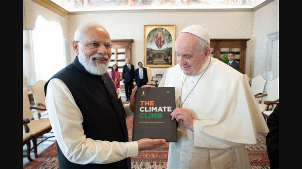 Modi explained to the 84-year-old Pontiff that the candelabra was specially made and the book is on climate change, an issue close to the Pope.
