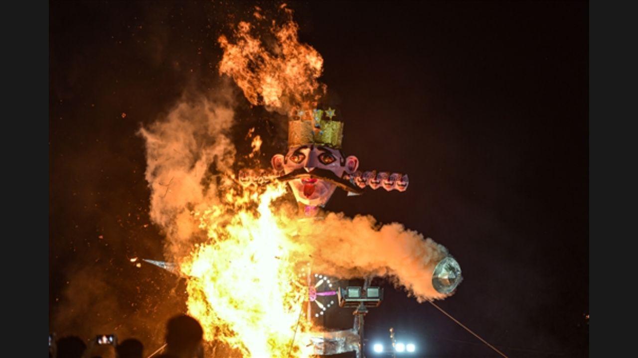 An effigy of 'Ravana' burns during Luv Kush Ramleela as part of Dussehra celebrations at Red Fort Ground in New Delhi. Pic/PTI