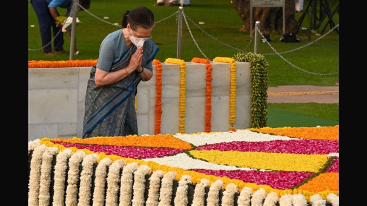 Congress President Sonia Gandhi pays her respect at the Mahatma Gandhi memorial at Rajghat in New Delhi on Saturday. PIc/ PTI