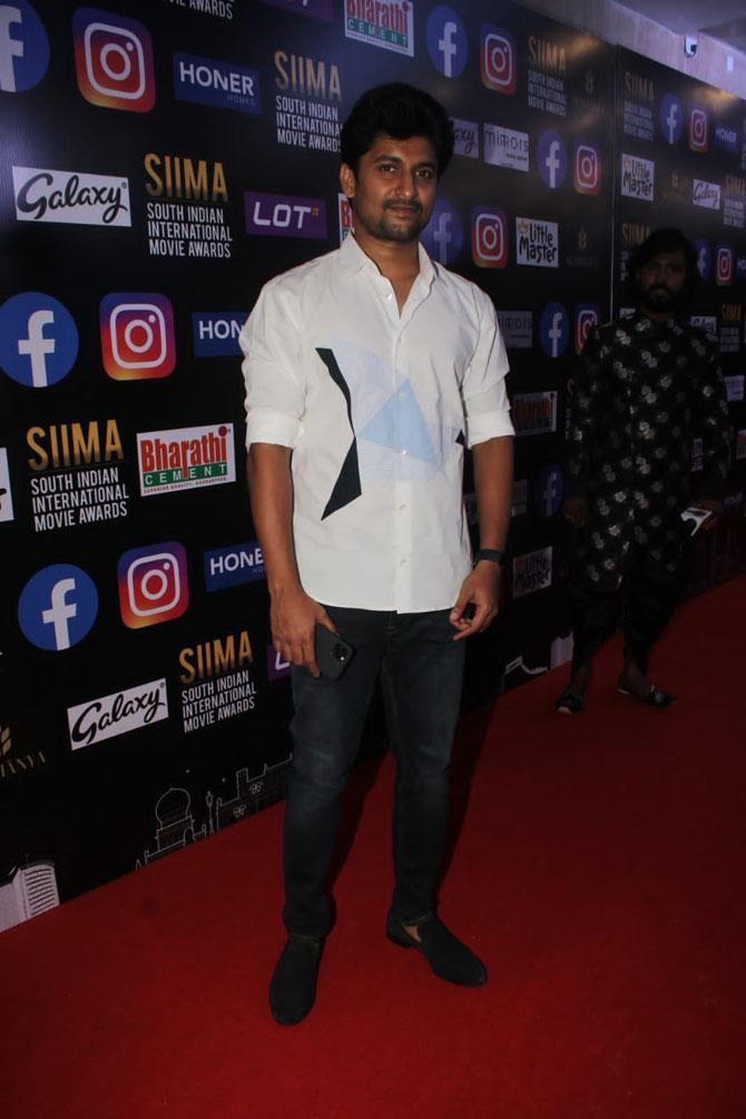 Ghanta Naveen Babu, aka Nani, was spotted at SIIMA 2021. The actor is known for playing the lead in the Telugu sports drama 'Jersey', which is now being remade in Hindi. Shahid Kapoor will be playing the lead in the Hindi version.
