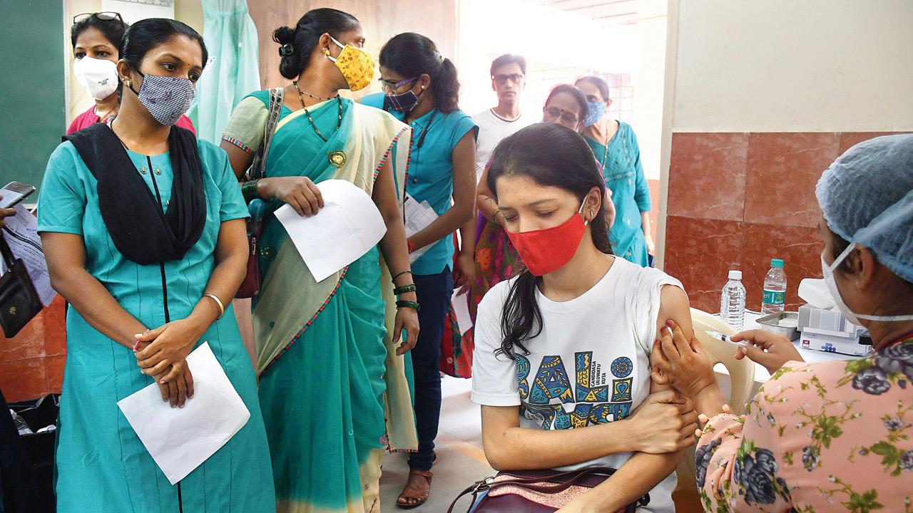 A beneficiary is given a dose of Covaxin at Matunga West on Monday. Pics/Ashish Raje