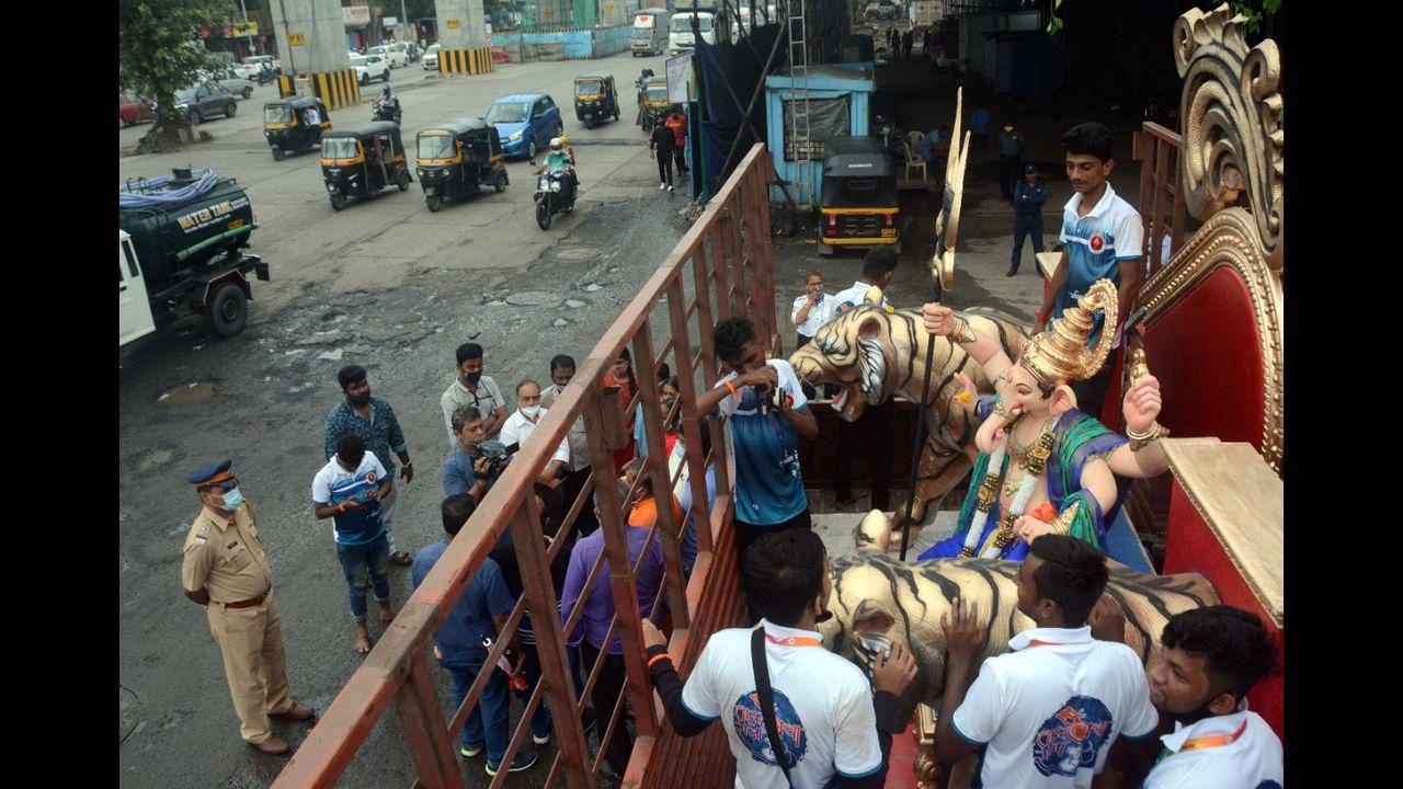 Ganesh mandals have also been told to issue tokens for those wanting to come to the mandal to pay their respects to Ganpati bappa. They have to give five tokens at a time in order to control crowds. Pic/Bipin Kokate