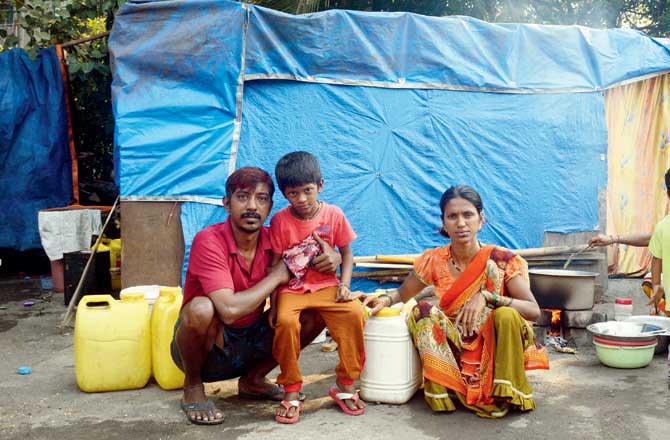 Where water is sold at an exorbitant price. Chavhan and his wife live with their six-year-old son on the service road in Dattani Park, Kandivli East