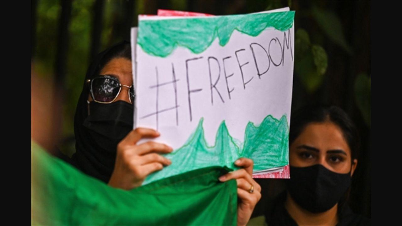 Women protestors can be seen holding a placard with 'freedom' written over it. In the newly formed Taliban govt, there is not a single woman inducted into the ministry. Pic/AFP