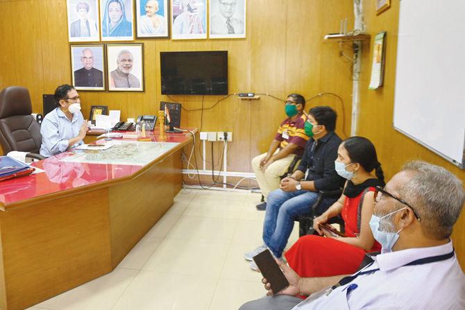 Nitin Arte, assistant municipal comissioner of B ward, holds a meeting with Dr Sandeep Gaikwad, medical health officer at E ward, and Dr Sharada Bhagat, assistant medical officer, at the municipal office in Umerkhadi