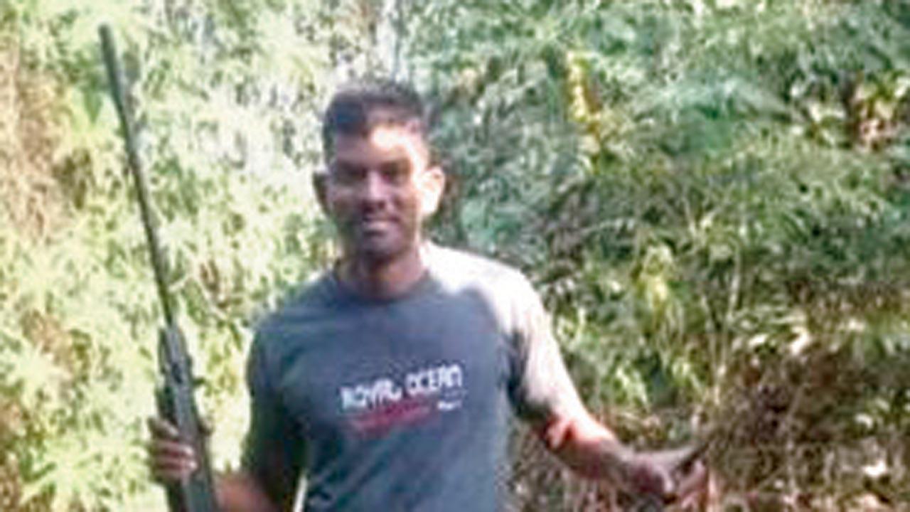 ‘Cop’ posing with gun and dead wetland bird sparks furore