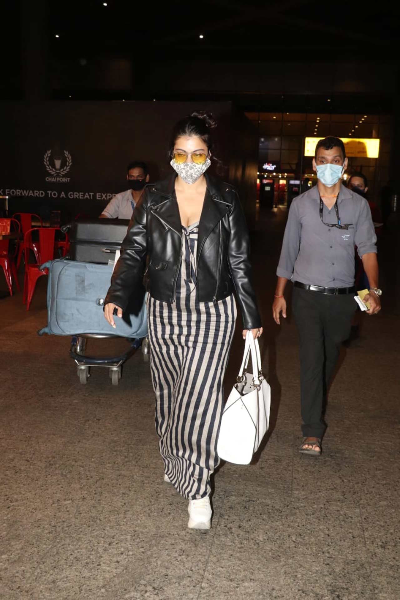 Kajol opted for a striped maxi dress as her airport look.
