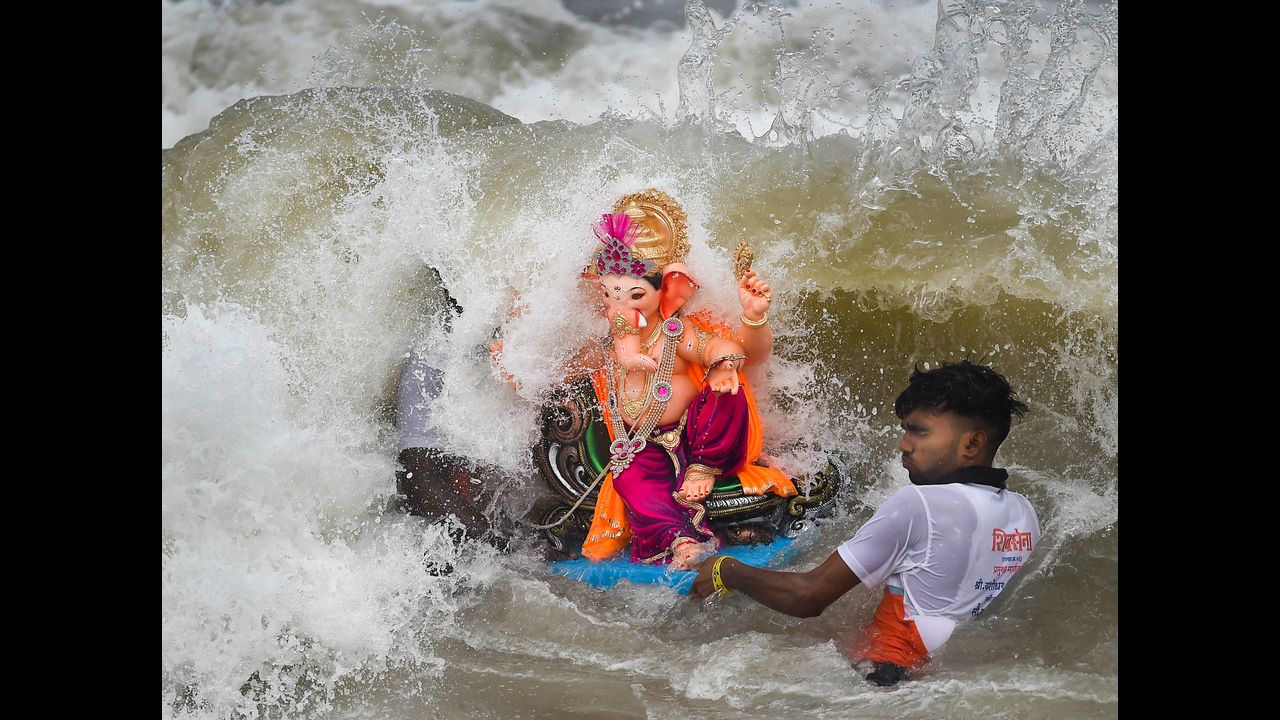 The immersion process is being carried out by BMC with the help of the metropolis' police. Pic/PTI