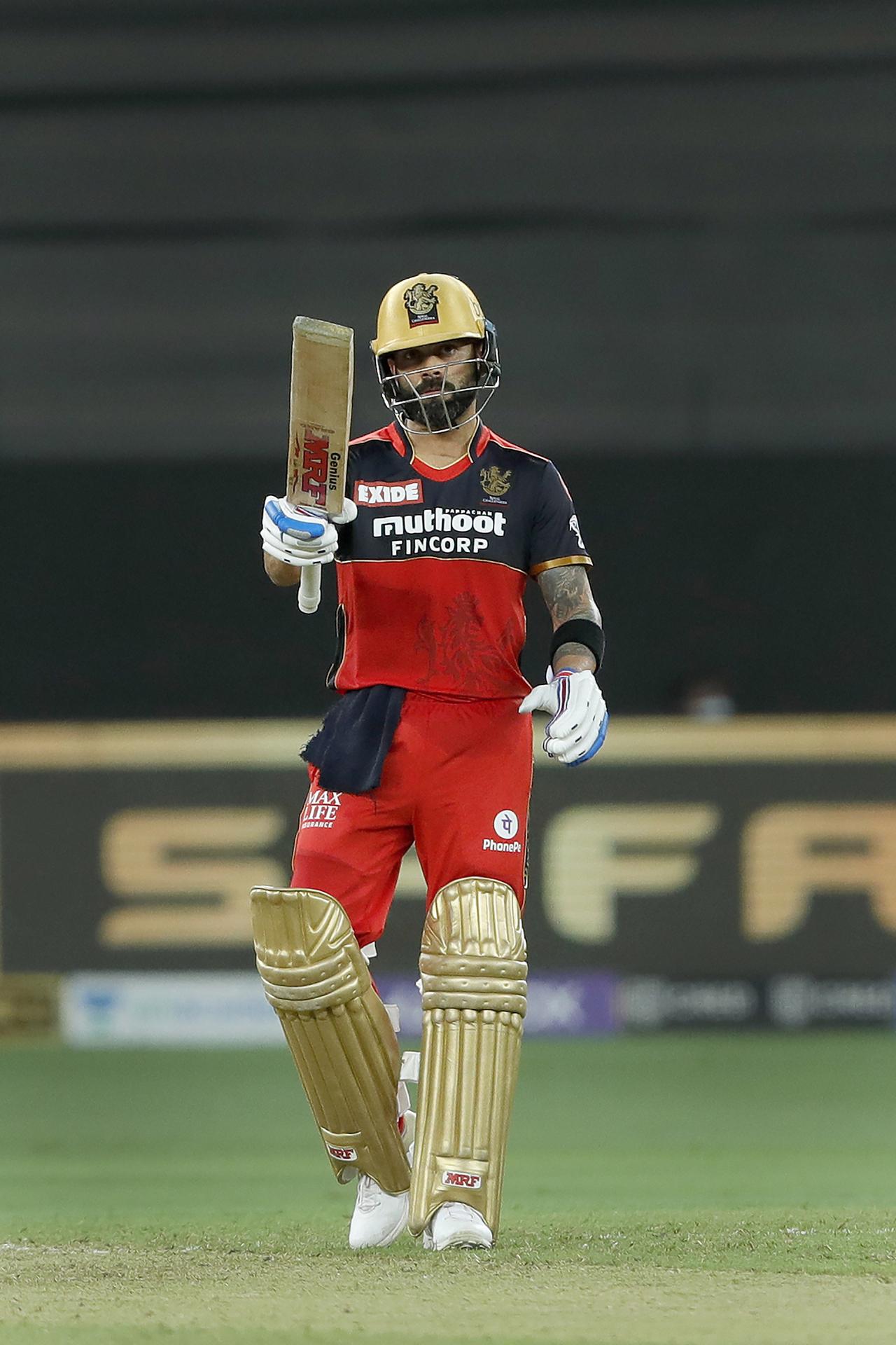Virat Kohli captain of Royal Challengers Bangalore celebrating his half century during match 39 of the Indian Premier League between the Royal Challengers Bengaluru and Mumbai Indians. Kohli became the first Indian cricketer to score 10,000 runs in T20s. Pic/ PTI