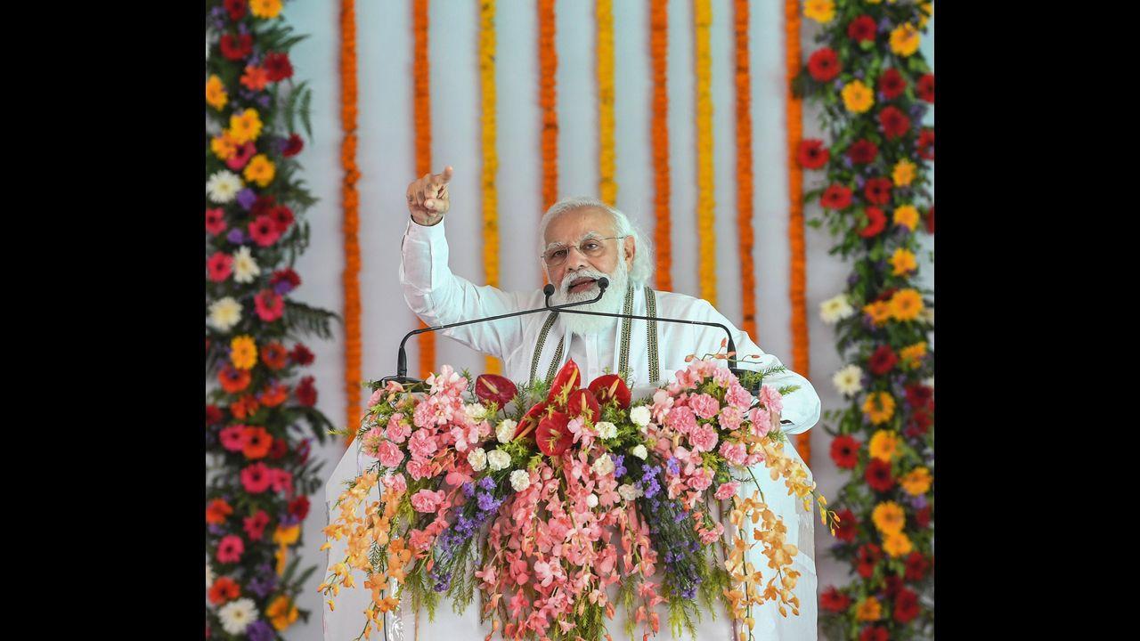 The party has said that five crore postcards will be sent to Modi by BJP booth workers from across the country, highlighting that they are committing themselves to public service. Pic/PTI