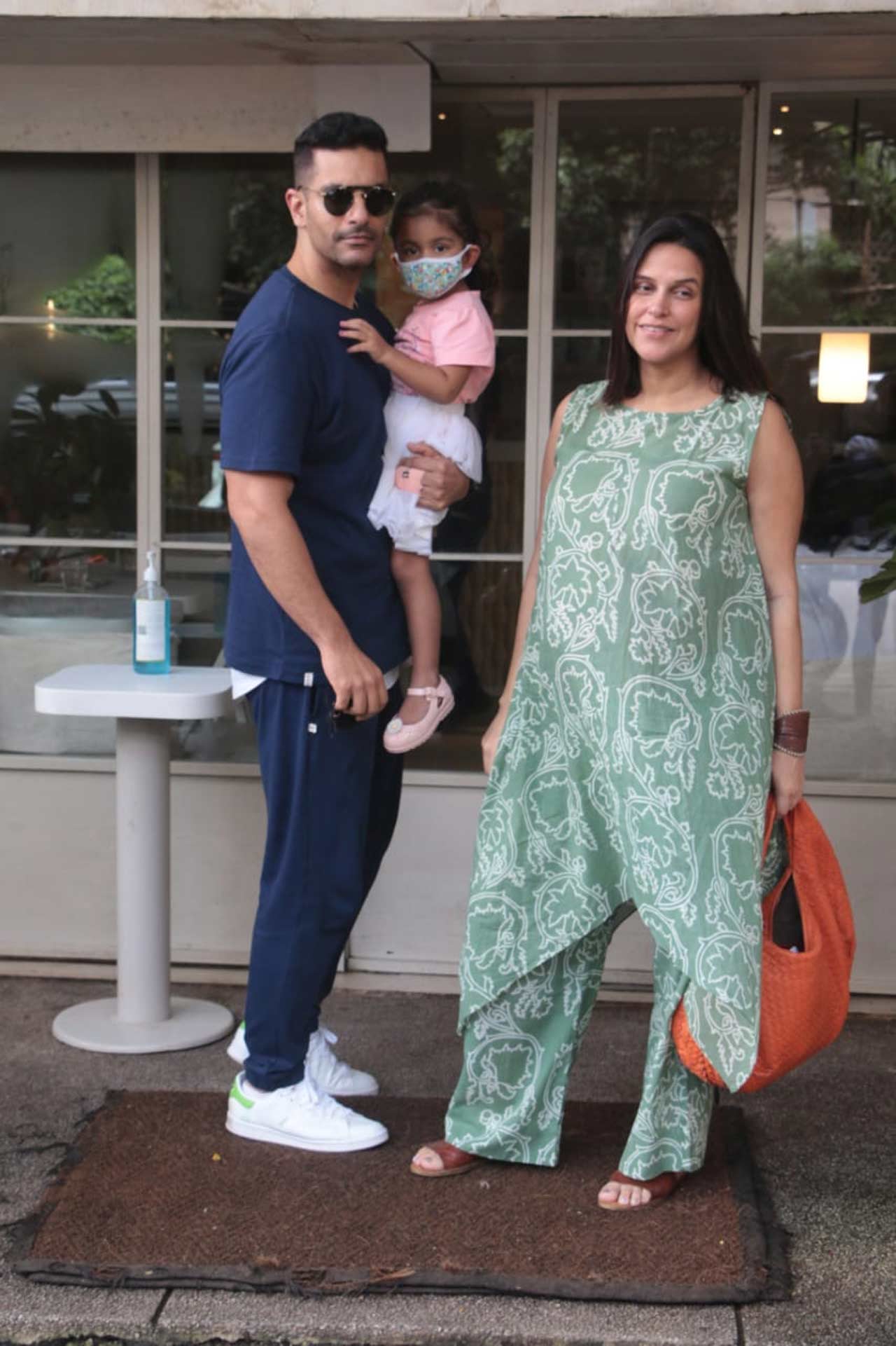 Neha Dhupia was snapped with her husband Angad Bedi and daughter Mehr Dhupia Bedi strolling on the streets of Bandra, Mumbai. Her pastel green kaftan suit was a perfect combination where style met comfort. Aren’t they a sight for sore eyes!