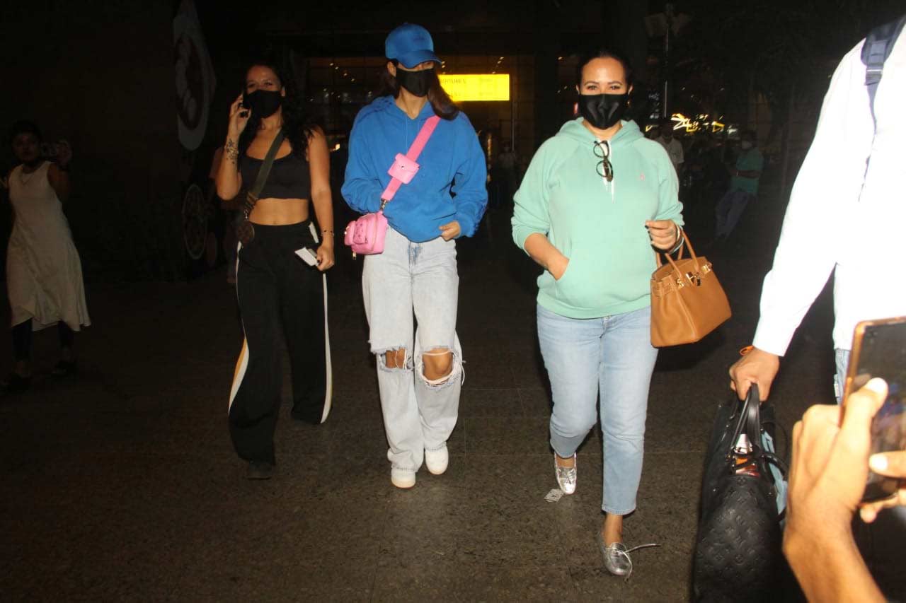 On the other hand, Disha Patani was also clicked with Tiger Shroff's sister Krishna Shroff and his mother Ayesha at the Mumbai airport. The actress was seen wearing a cap, paired with a blue coloured hoodie and distressed denim.