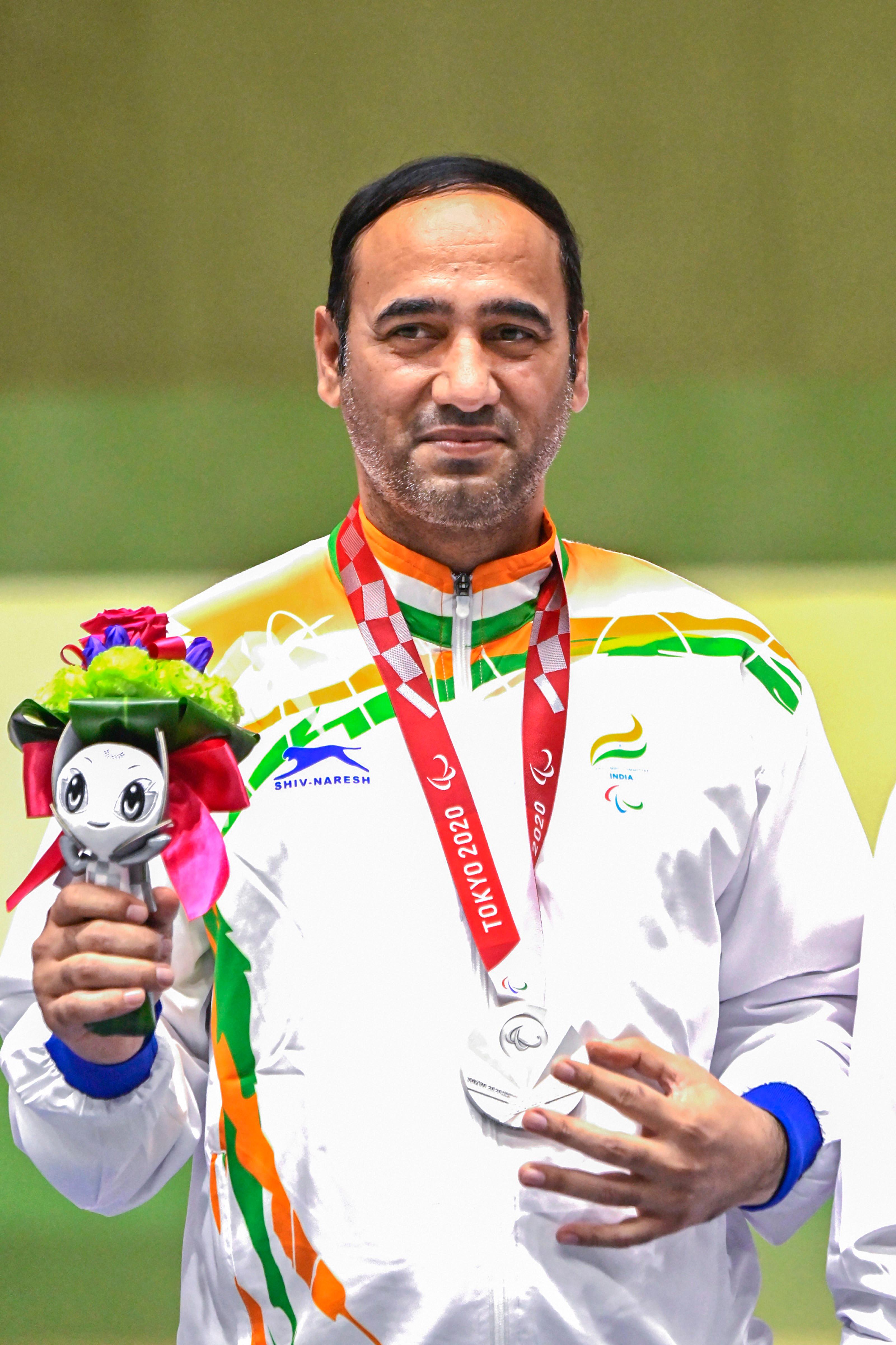 Singhraj Singh Adana - Singhraj Adana bagged the silver in the P4 Mixed 50m Pistol SH1 event at the Tokyo Paralympics. Adana, who had won the bronze in the P1 men's 10m air pistol SH1 event earlier, added a silver to his kitty with an effort of 216.7