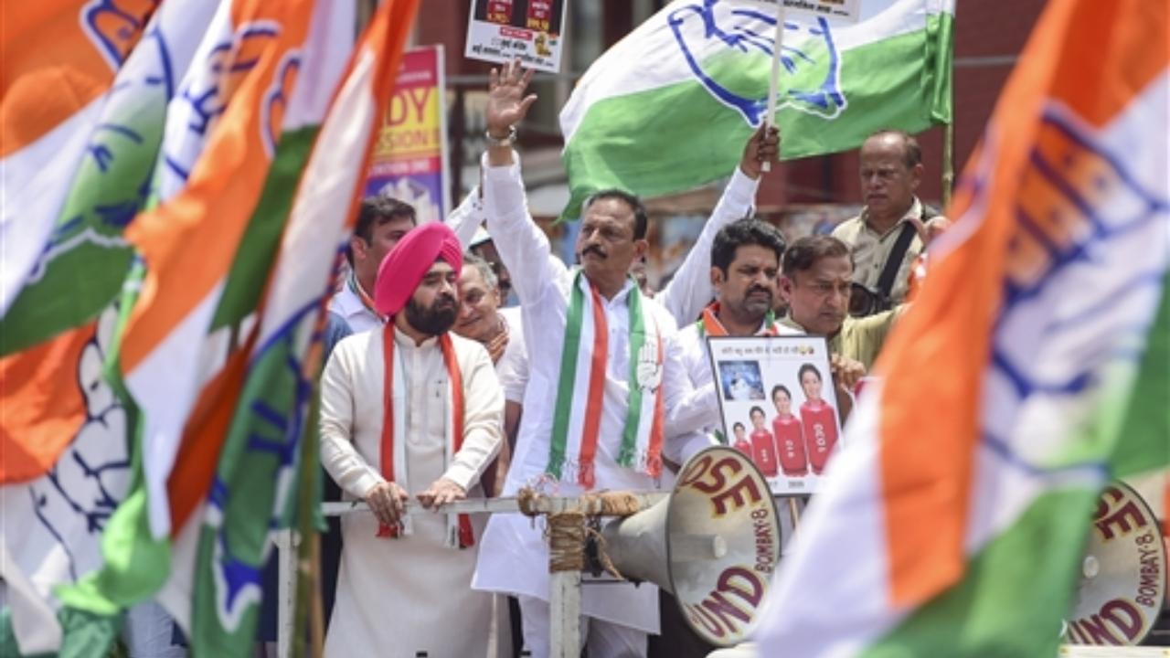 Mumbai Congress President Bhai Jagtap with party workers stage a protest against the hike in prices of petrol, diesel and LPG cylinders