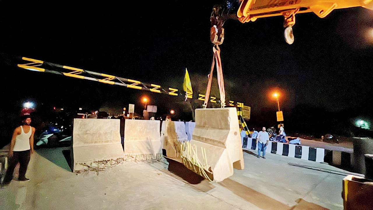 A few minutes later, locals brought a crane to move the barricades to the side