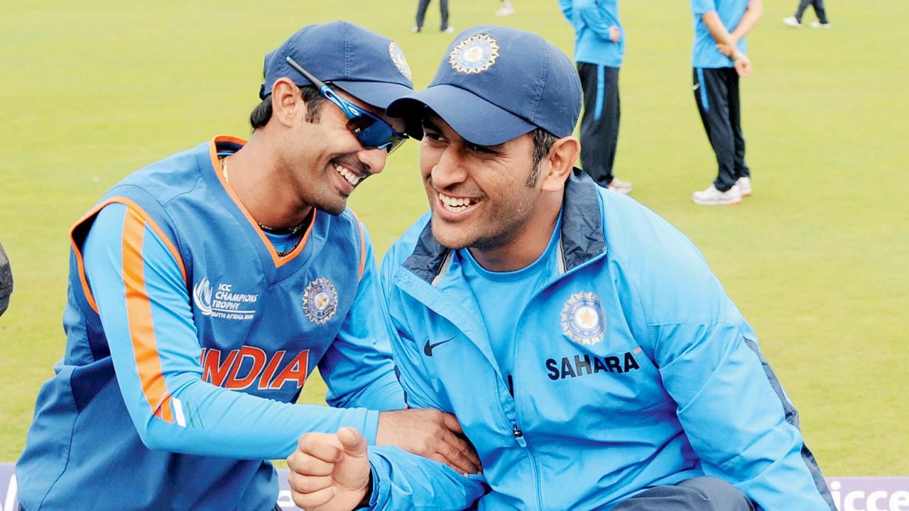 Dinesh Karthik (left) shares a light moment with then India captain MS Dhoni in 2009. Pic/Getty Images