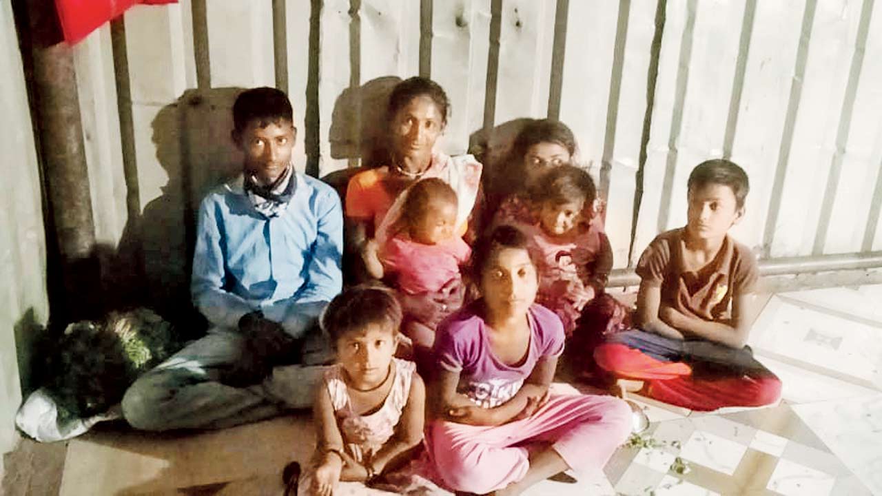 Swati Kale, Bhima’s widow, with their children