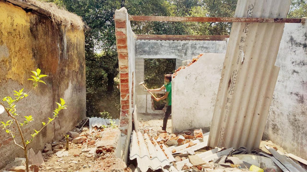 Demolition in progress at one such illegal structure in Kopri, Thane, on Friday