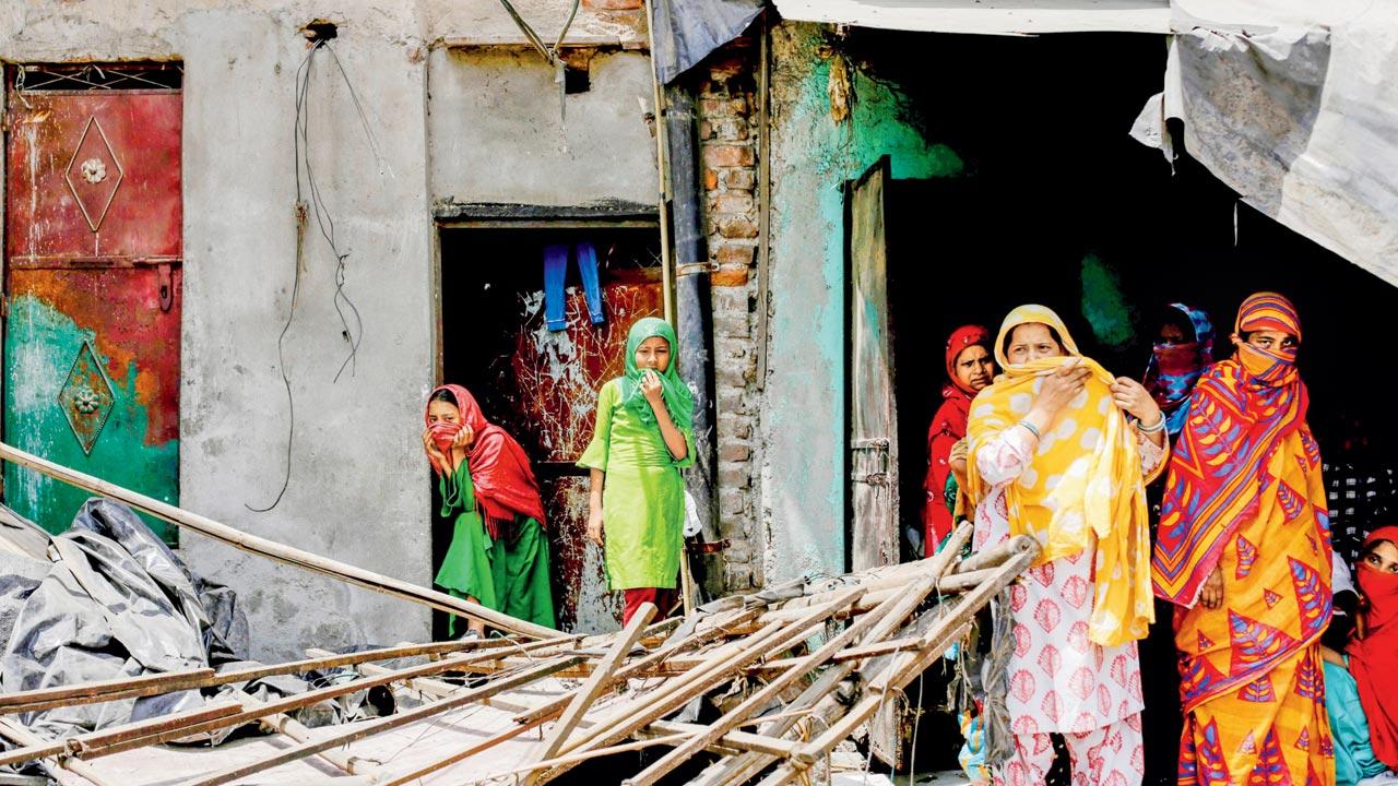 Residents stand near the rubble of demolished construction in New Delhi’s Jahangirpuri neighbourhood. Pic/Getty Images