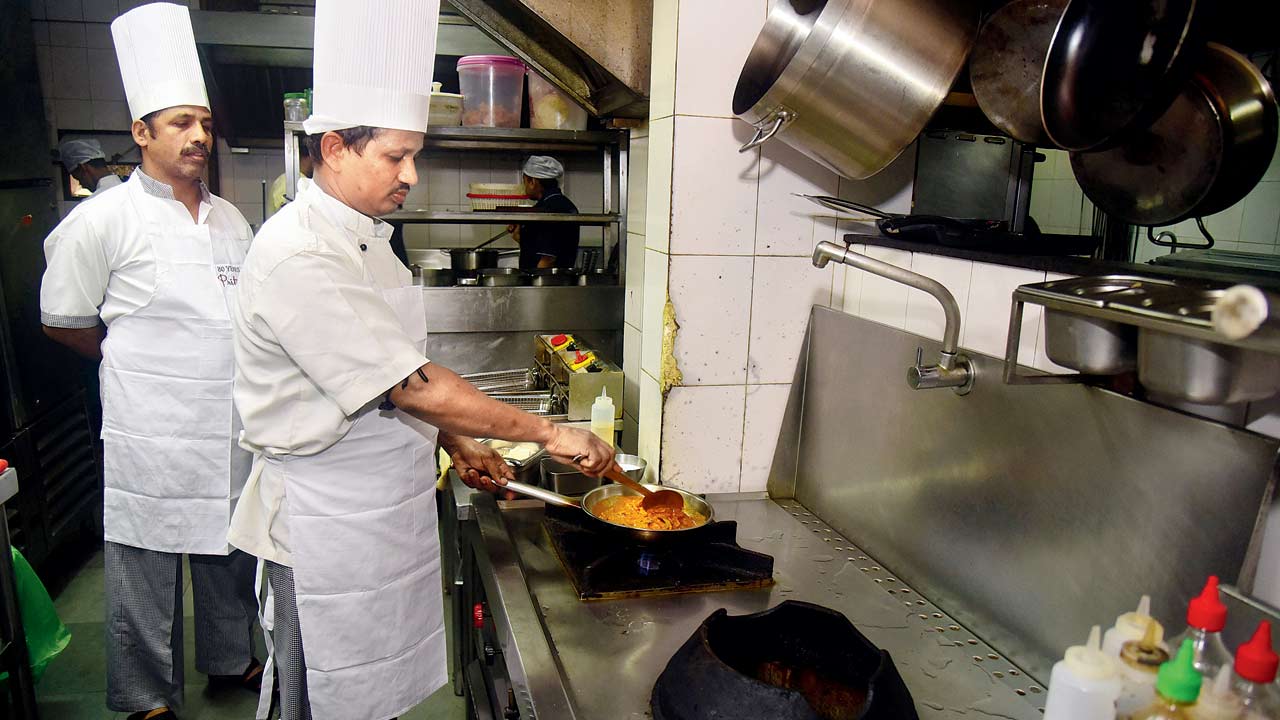 (From left) Chefs Sunil Bachulkar and Ramakanta Malik now carry the mantle of Pritam’s much-loved recipes such as butter chicken and dal makhani