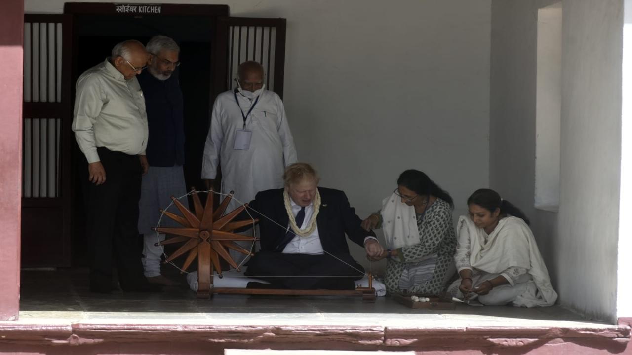PHOTOS: UK PM Boris Johnson visits Sabarmati Ashram, tries hand at charkha